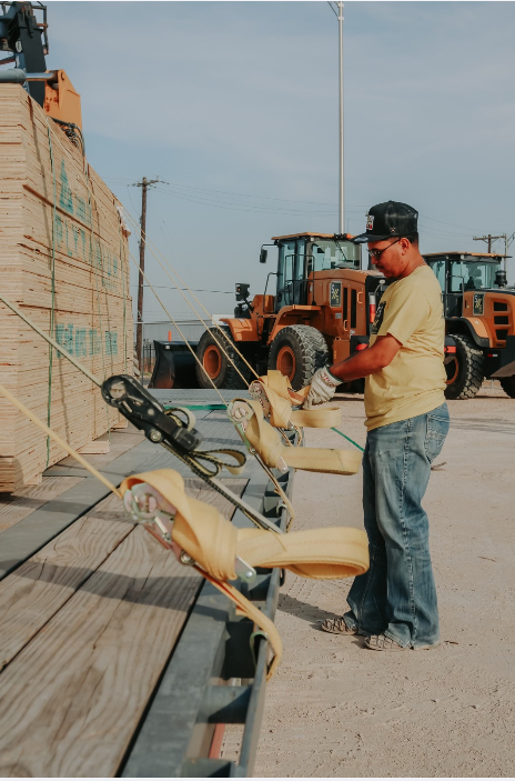 A States Supplies team member strapping a lumber load in the Midland yard